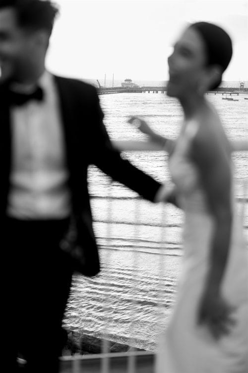 Bride and groom laugh on Harbour Room Rooftop